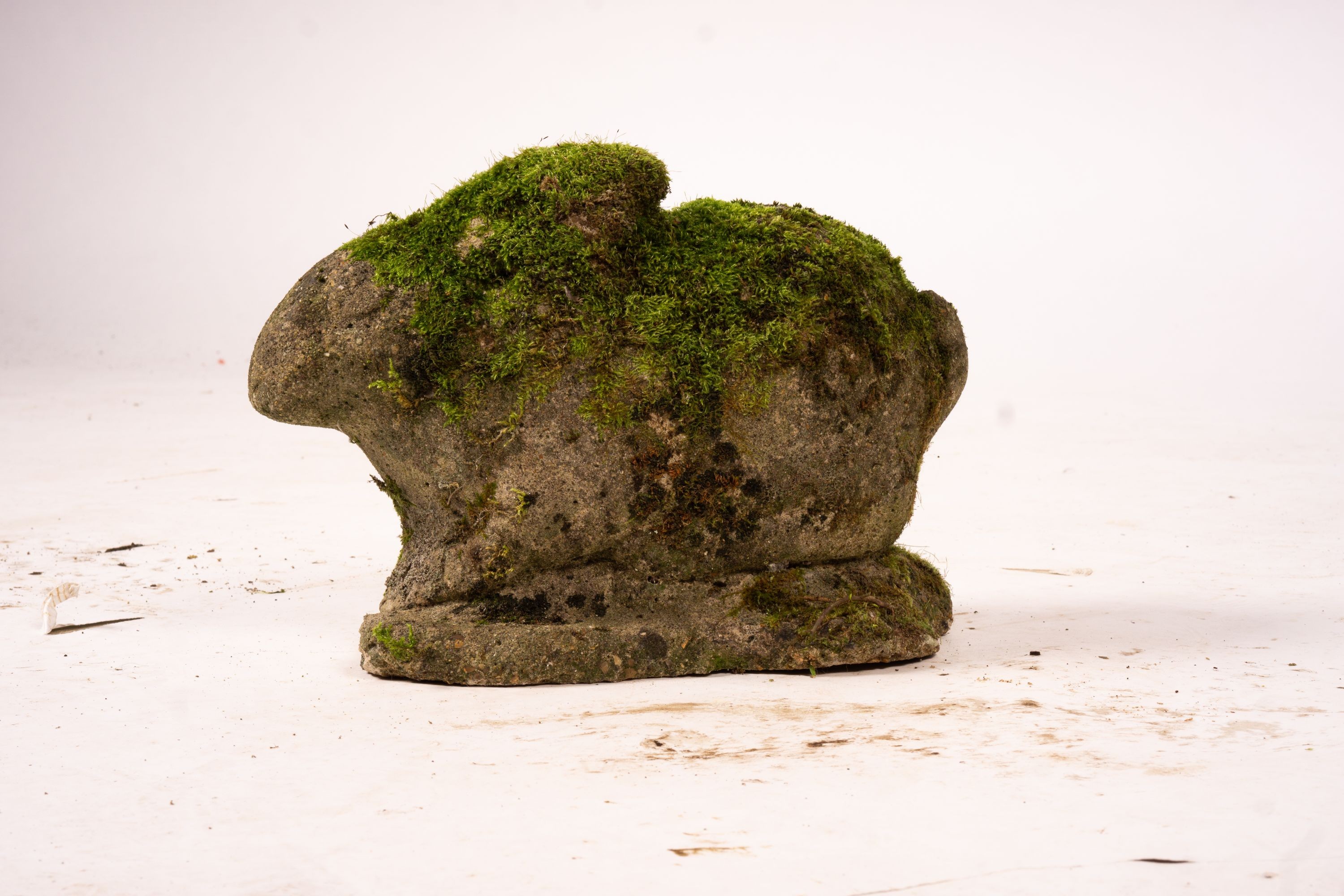 Three reconstituted stone garden ornaments, squirrels and rabbit, tallest 34cm